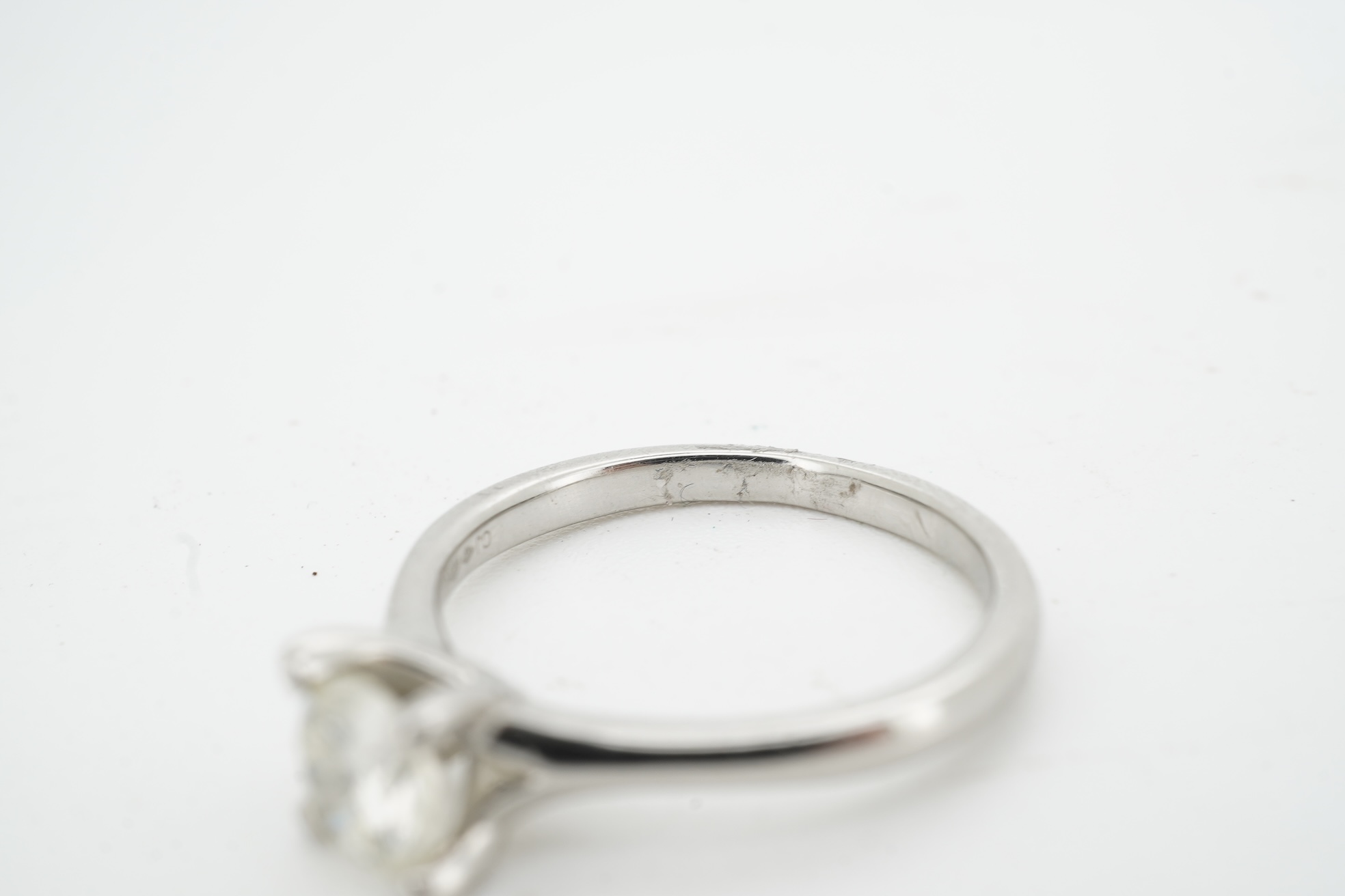 A diamond ring, claw-set with a brilliant-cut diamond weighing approximately 0.50 carats, mounted in platinum, size K, British hallmarks, gross weight approximately 4 grams